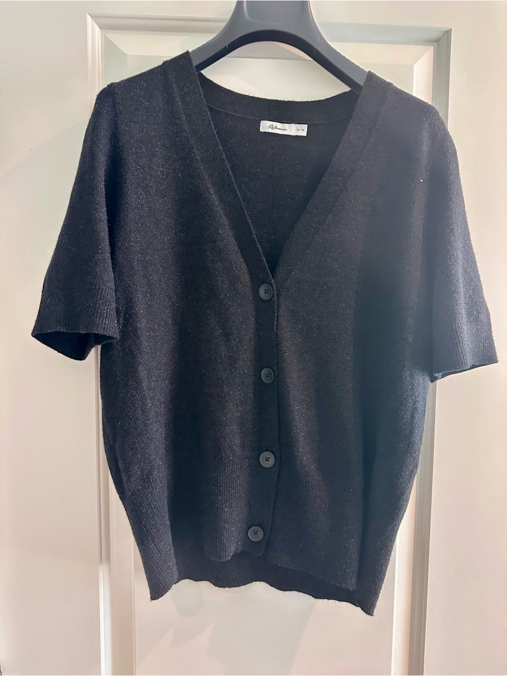 Black shimmery cardigan from Reitman’s. Size XL.
